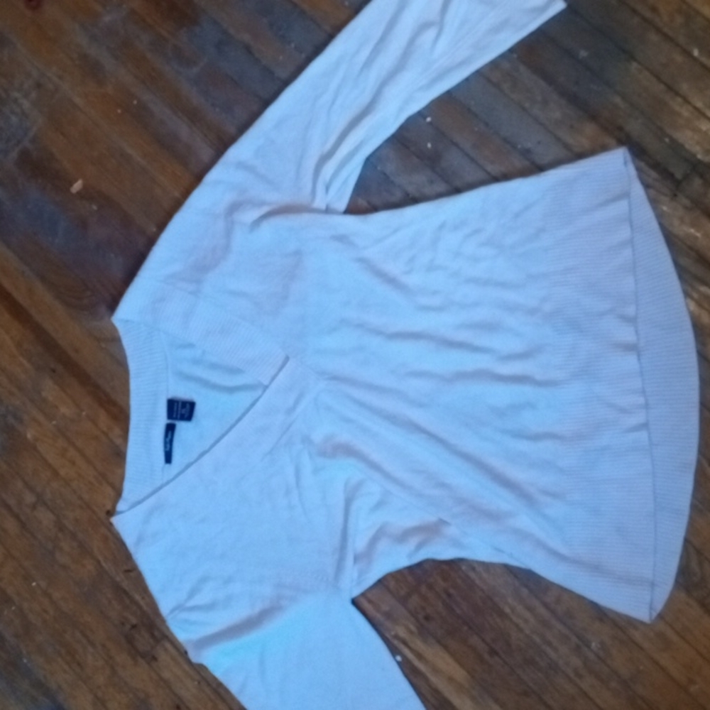 It's a long sleeve shirt it's a lil cropped in the front